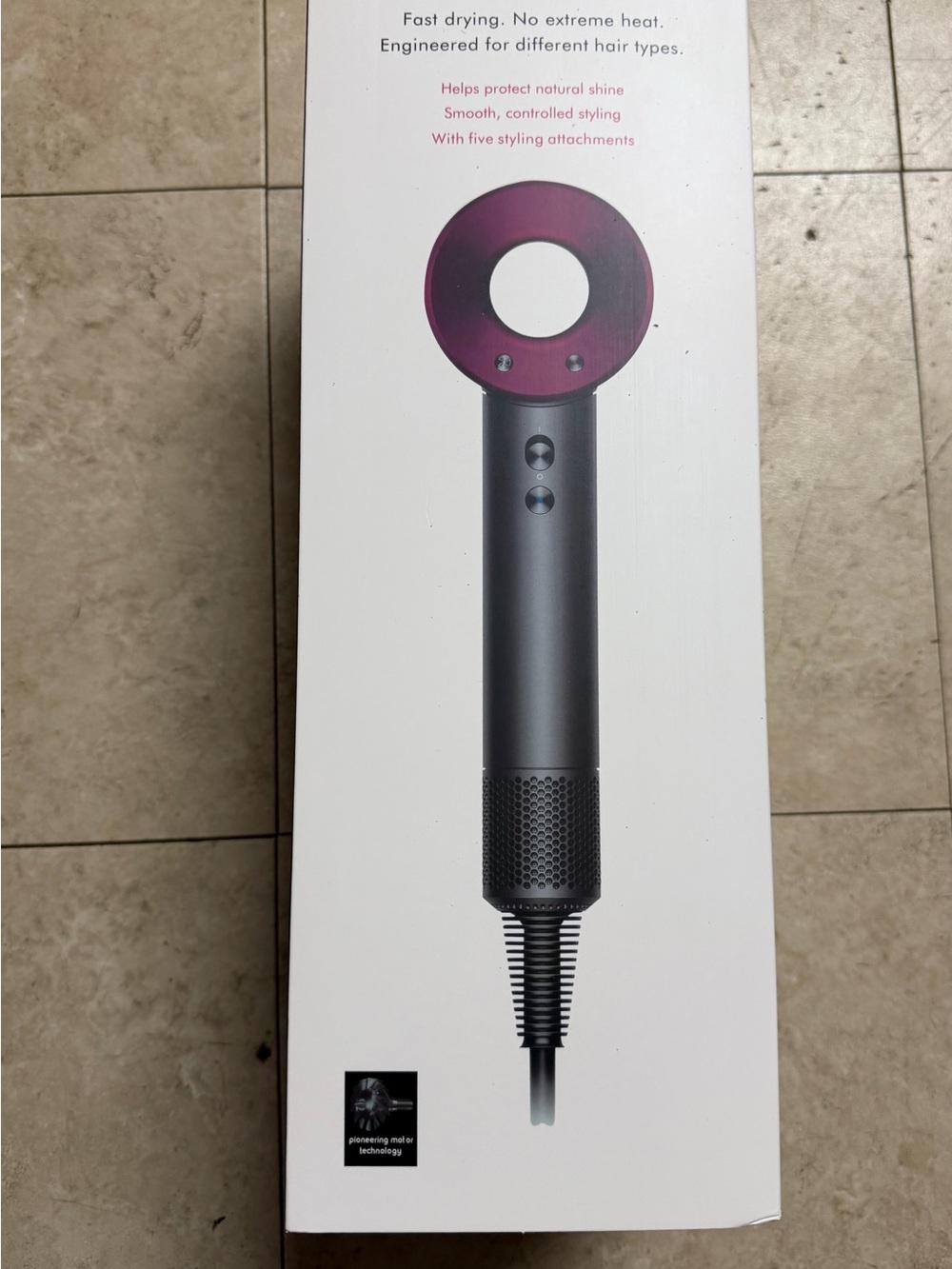 Dyson Hair dryer in fucsia and grey metal